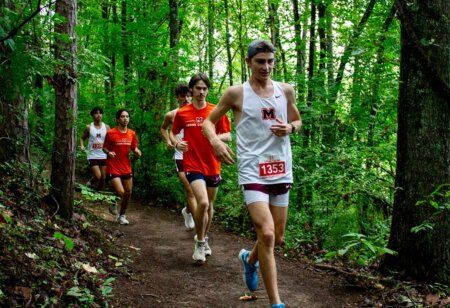 Runners in woods