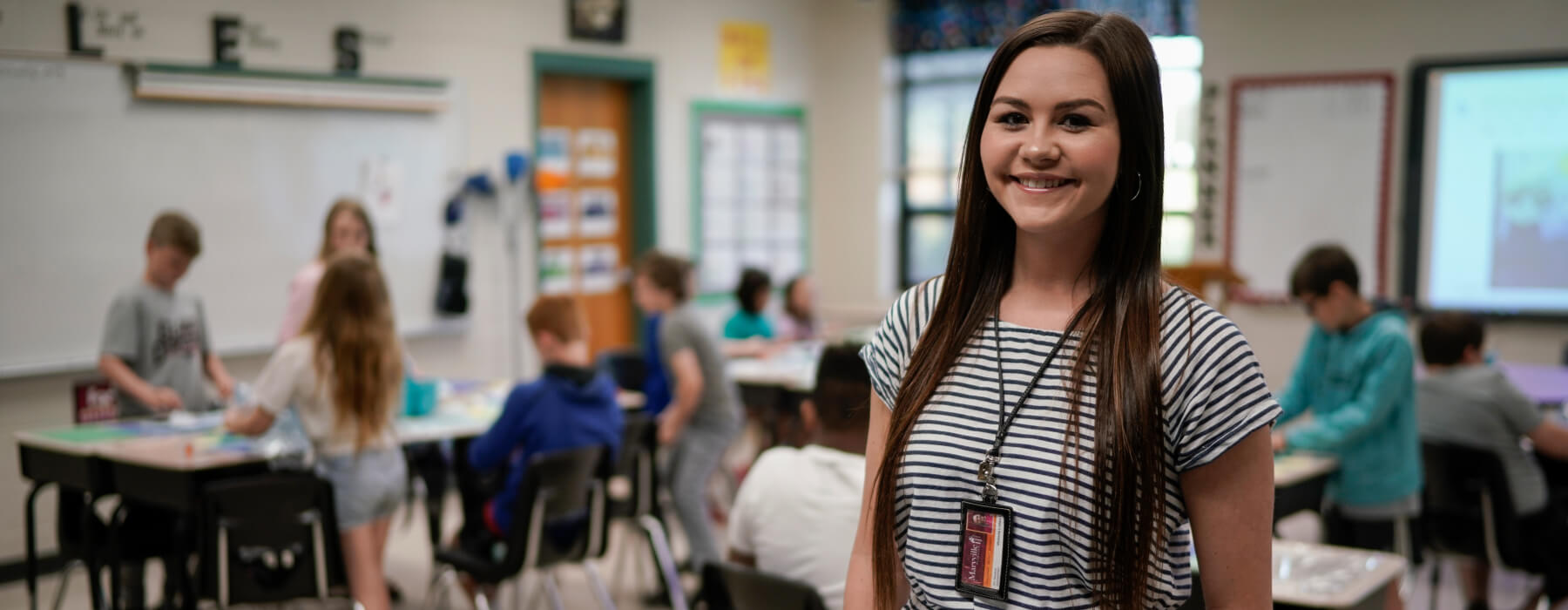MC student working with children in a classroom
