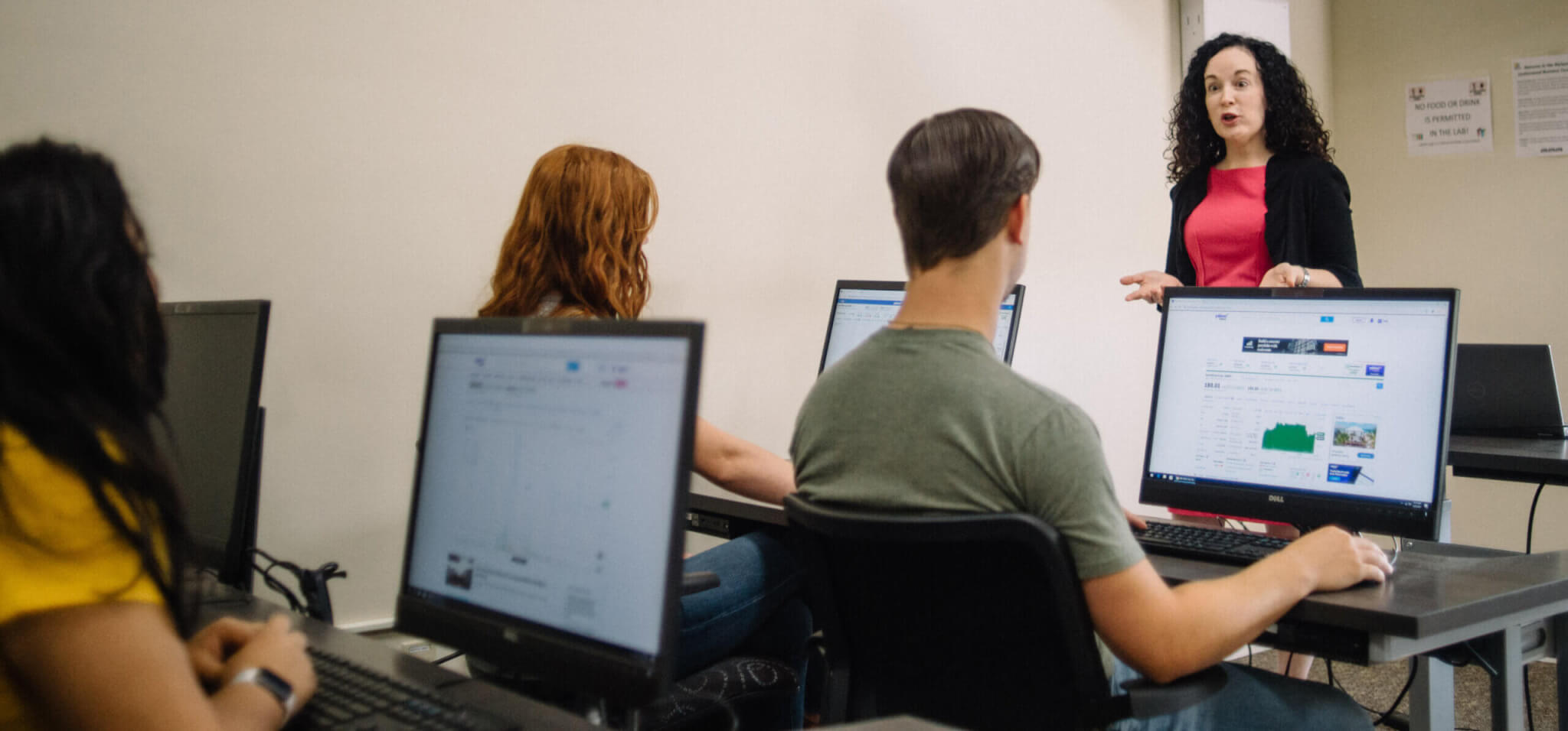 Professor teaching business analytics to students in classroom at Maryville College