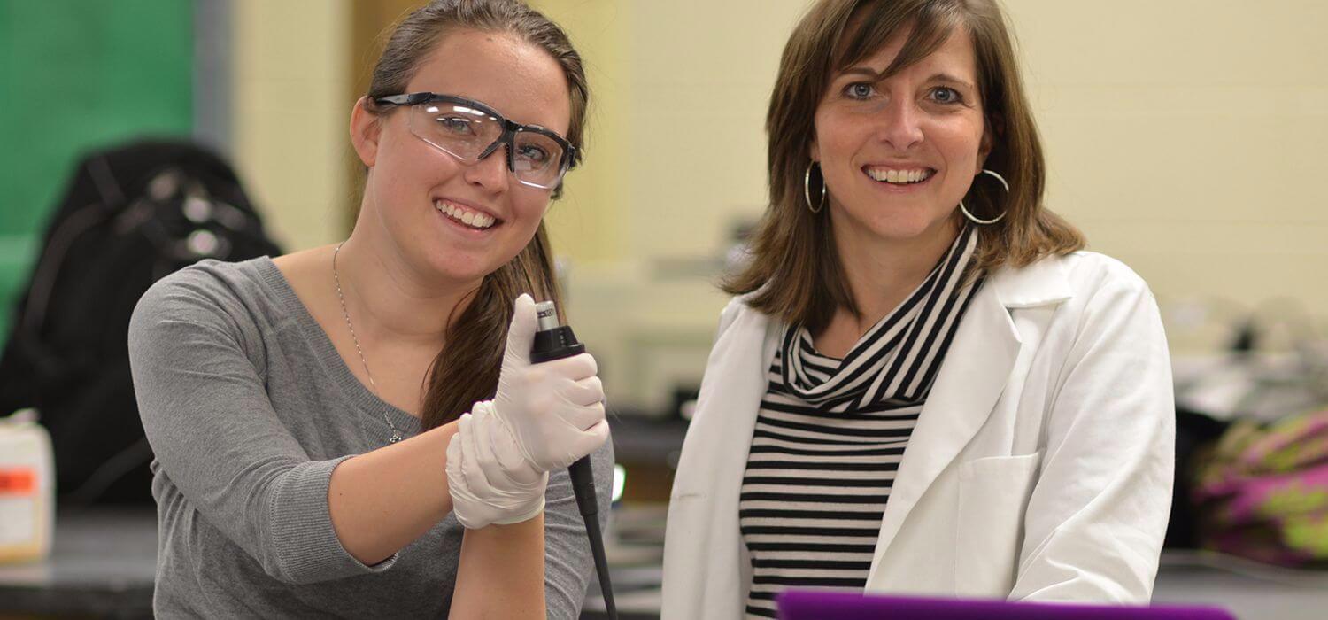 Biochemistry student with professor in lab