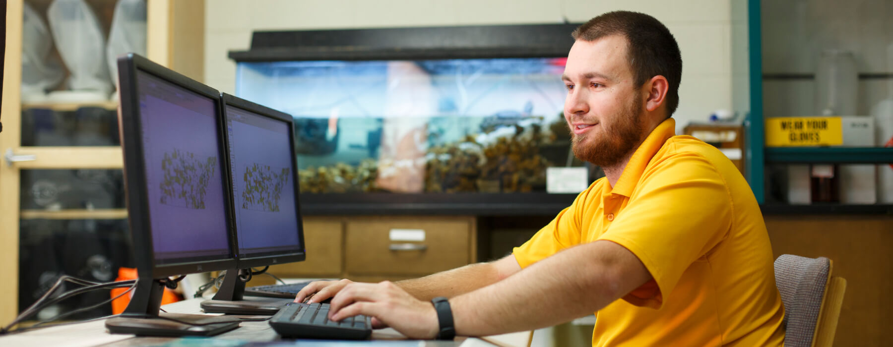 Photo of an environmental science student in a lab