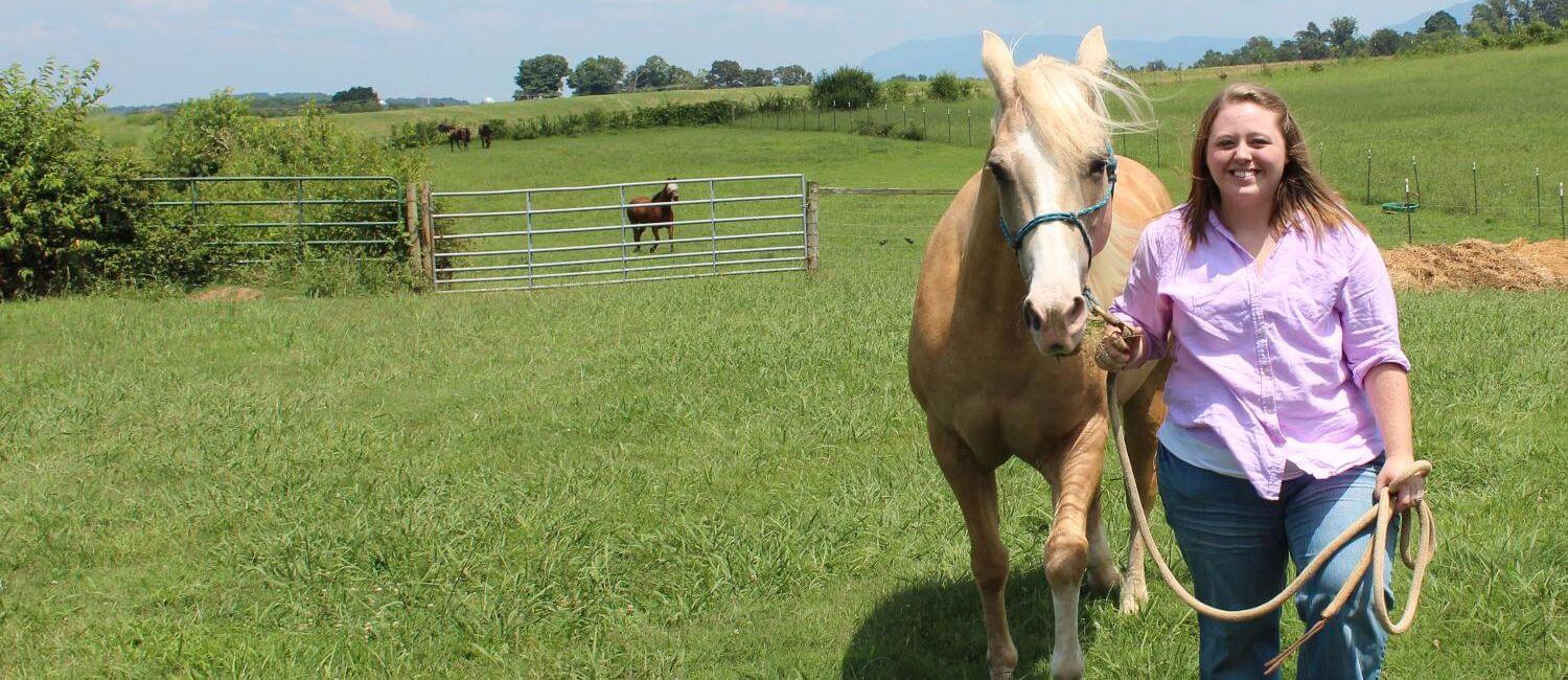 MC student with horse in pasture, pre-vet