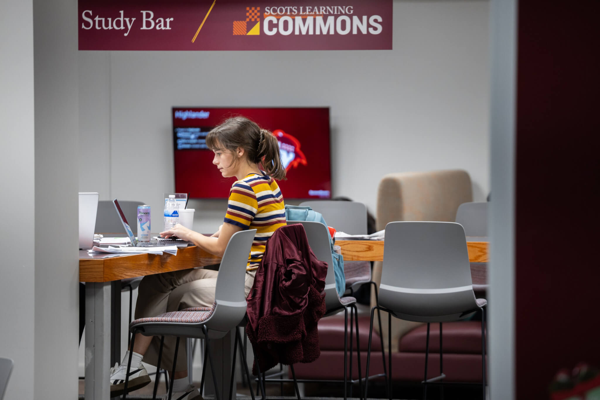 A student works on a laptop at the Study Bar.