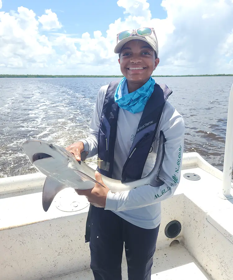Photo of alumna Justice Williams who graduated with a degree in Environmental Science.