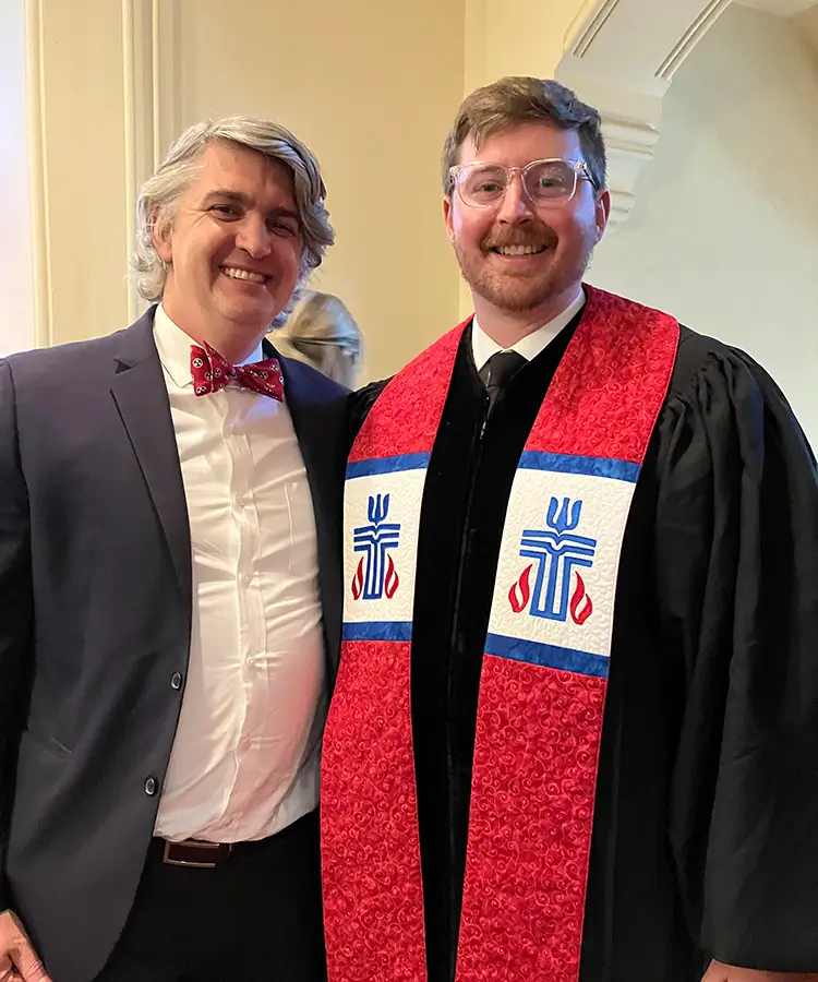 Photo of alumni Sam Phillips, who recently graduated with a degree in Religion, standing next to alumni Matt Frease.