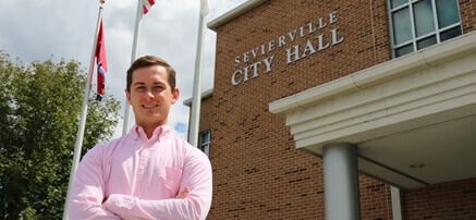 Student outside city hall