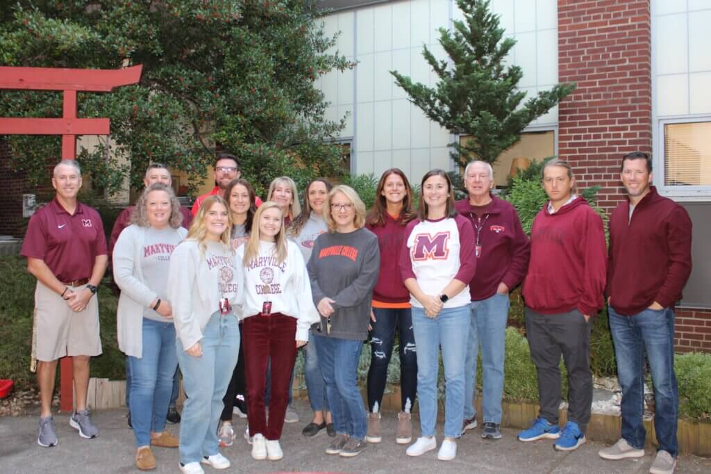 Maryville College Alumni standing together after a meeting