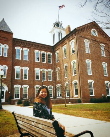Student sitting on a bench 