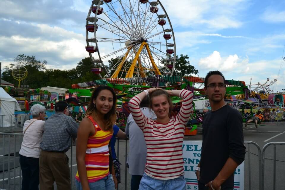 Students in front of Ferris Wheel