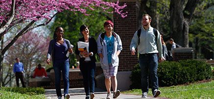 students walking across campus