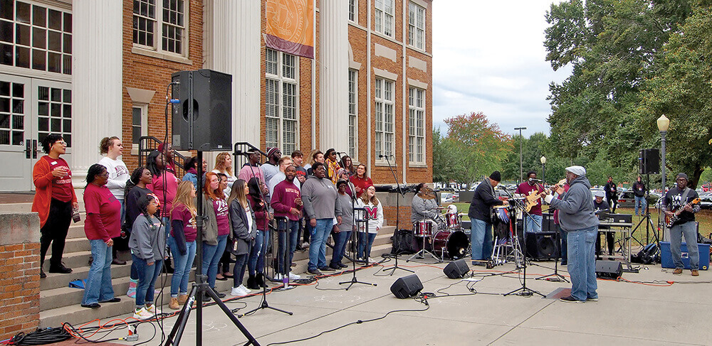 Voices of Praise choir singing at Homecoming