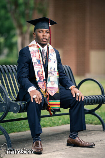 Photo of Drew Collins in graduation regalia