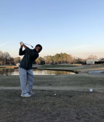 Photo of Drew Collins playing golf