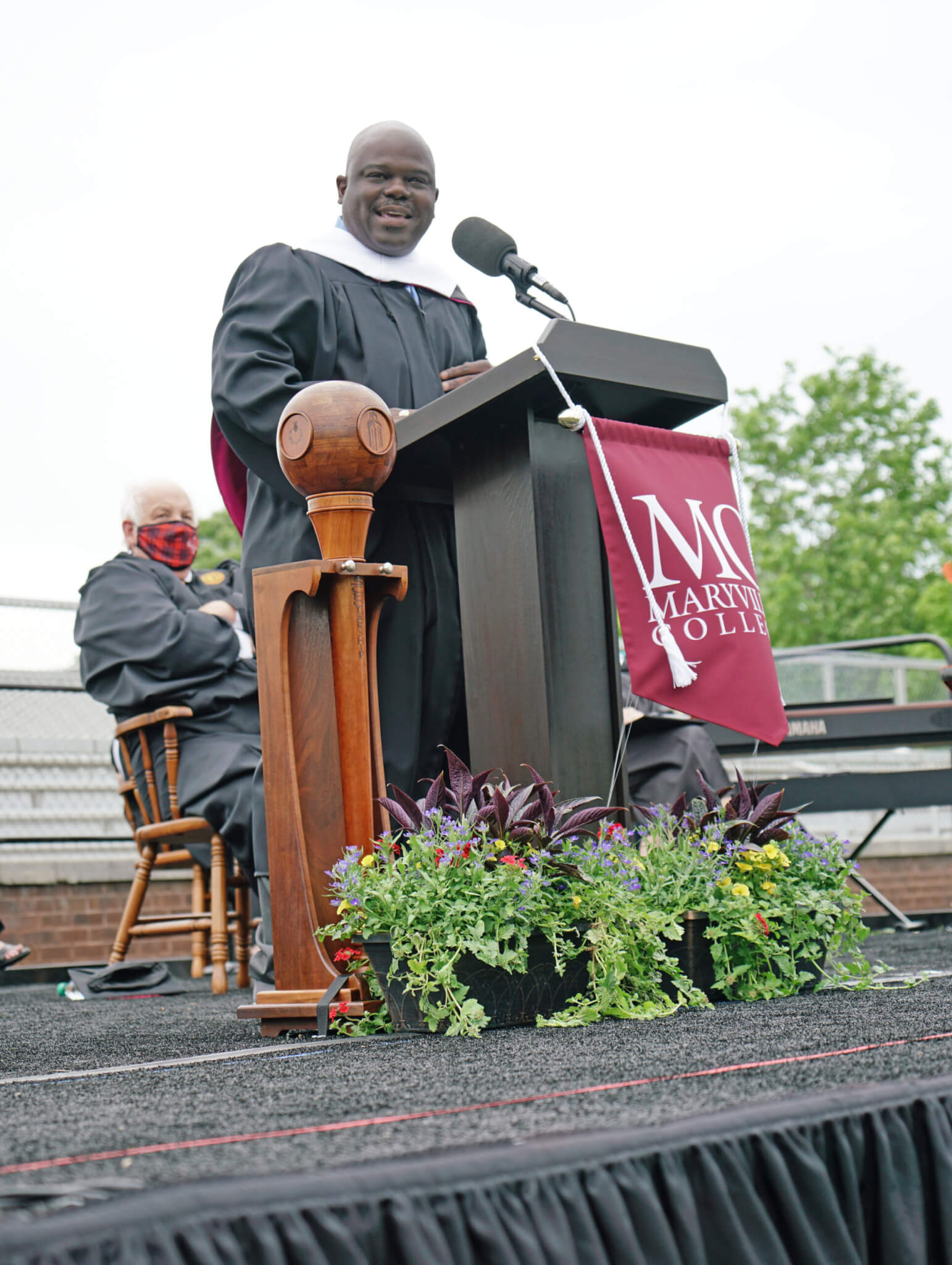 Photo of Cassius Cash at podium