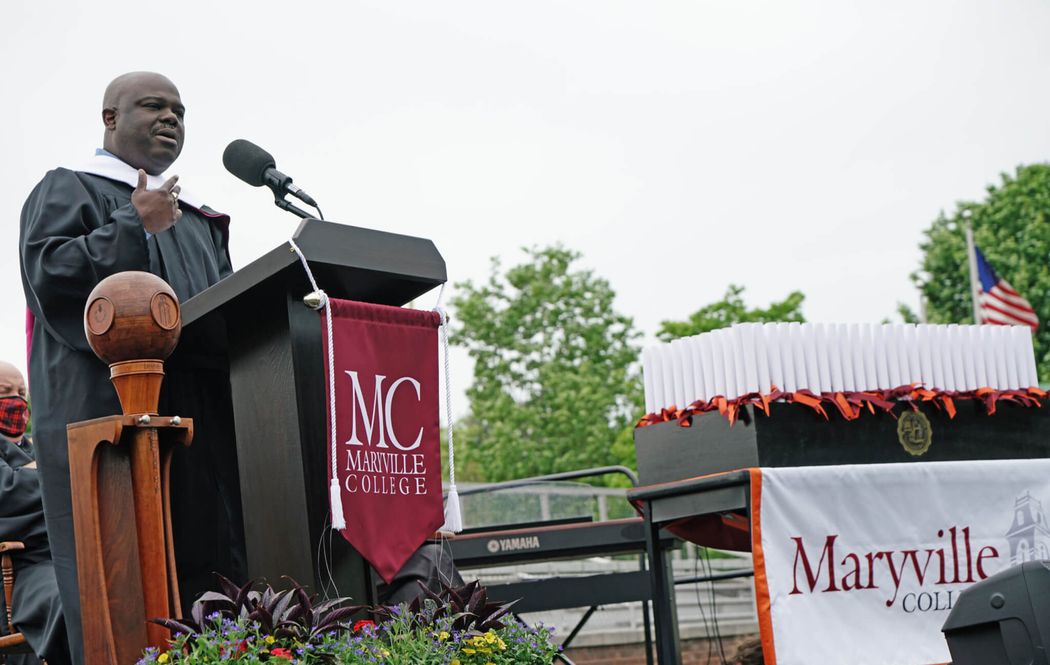 Photo of Cassius Cash at podium
