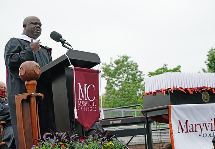 Photo of Cassius Cash at podium