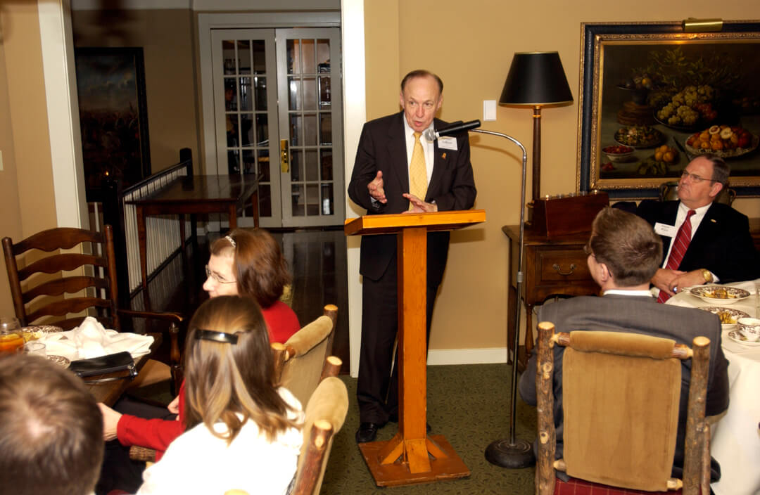 President Gibson addresses guests at RT Lodge
