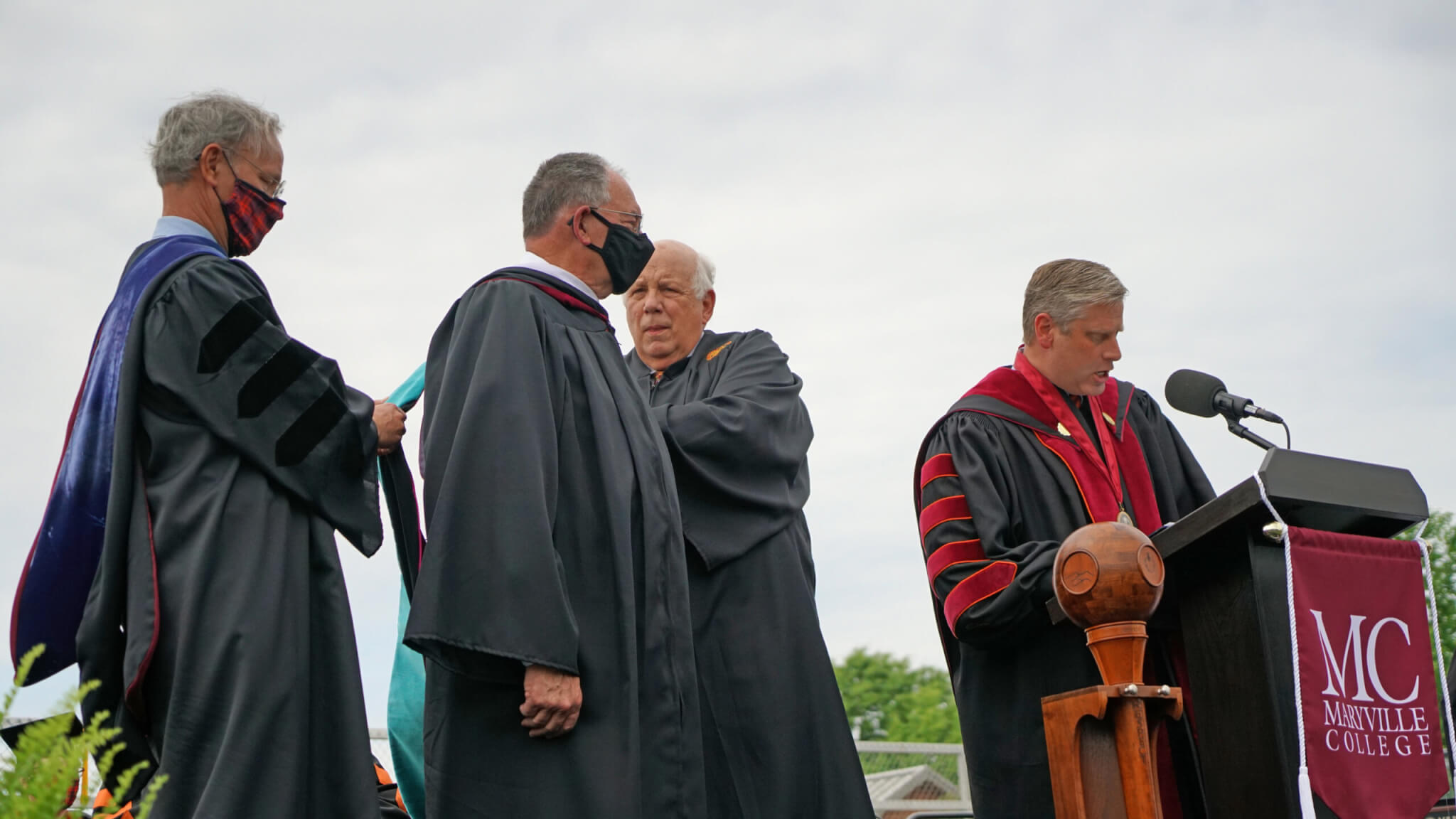 Photo of Tom Taylor receiving honorary doctorate