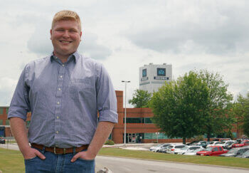 Photo of Matthew Swartz in front of Arconic building