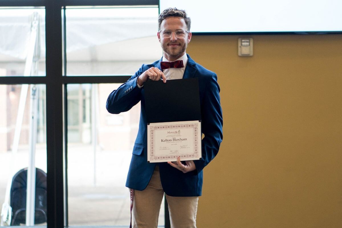 Photo of Kelton Bloxham with his award