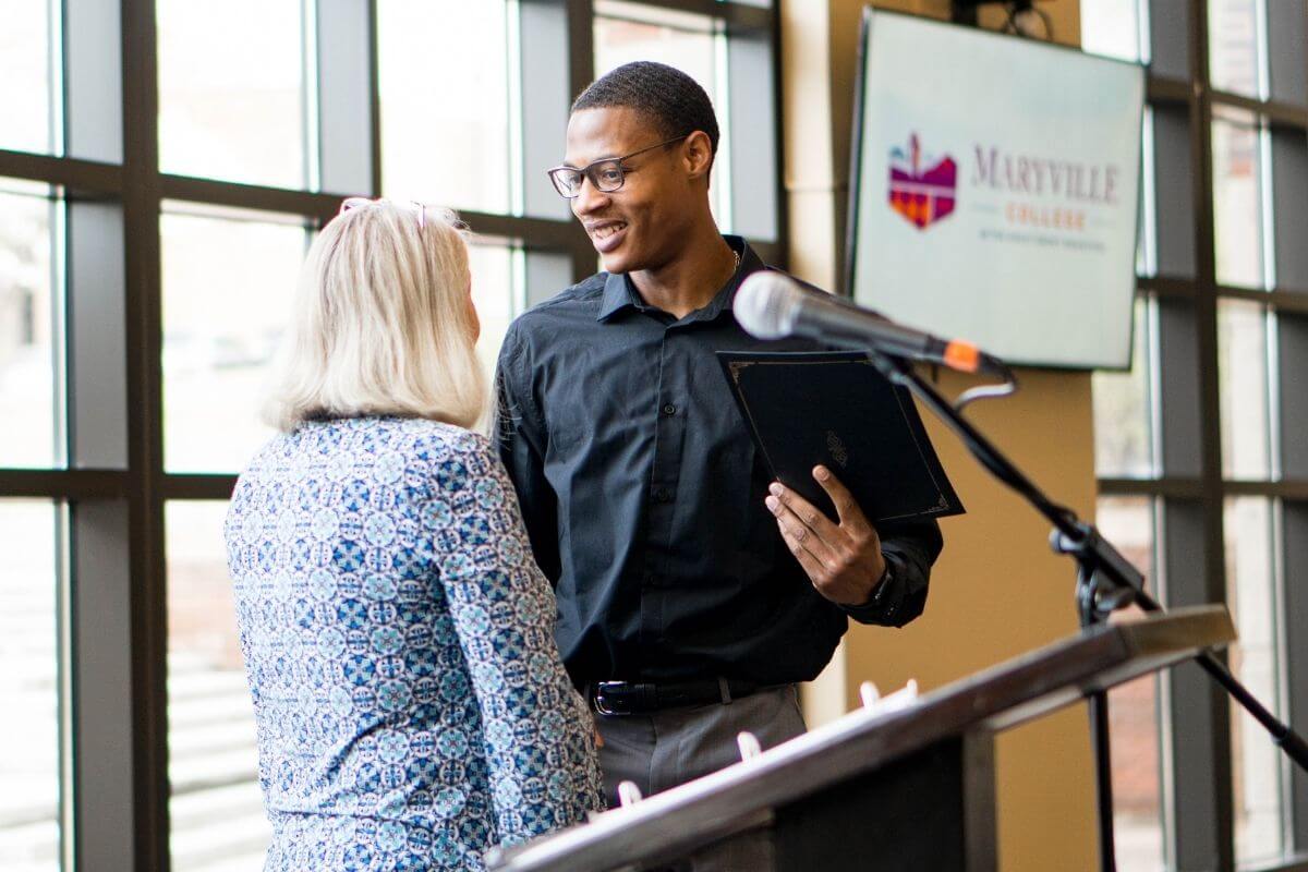 Photo of Nicholas Clifton receiving award