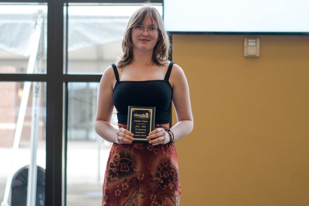 Photo of Catelee Crow with her award