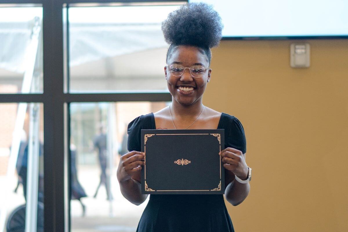Photo of Amiana Grady with her award