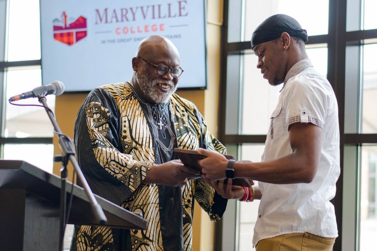 Photo of Daniel Jackson being presented award