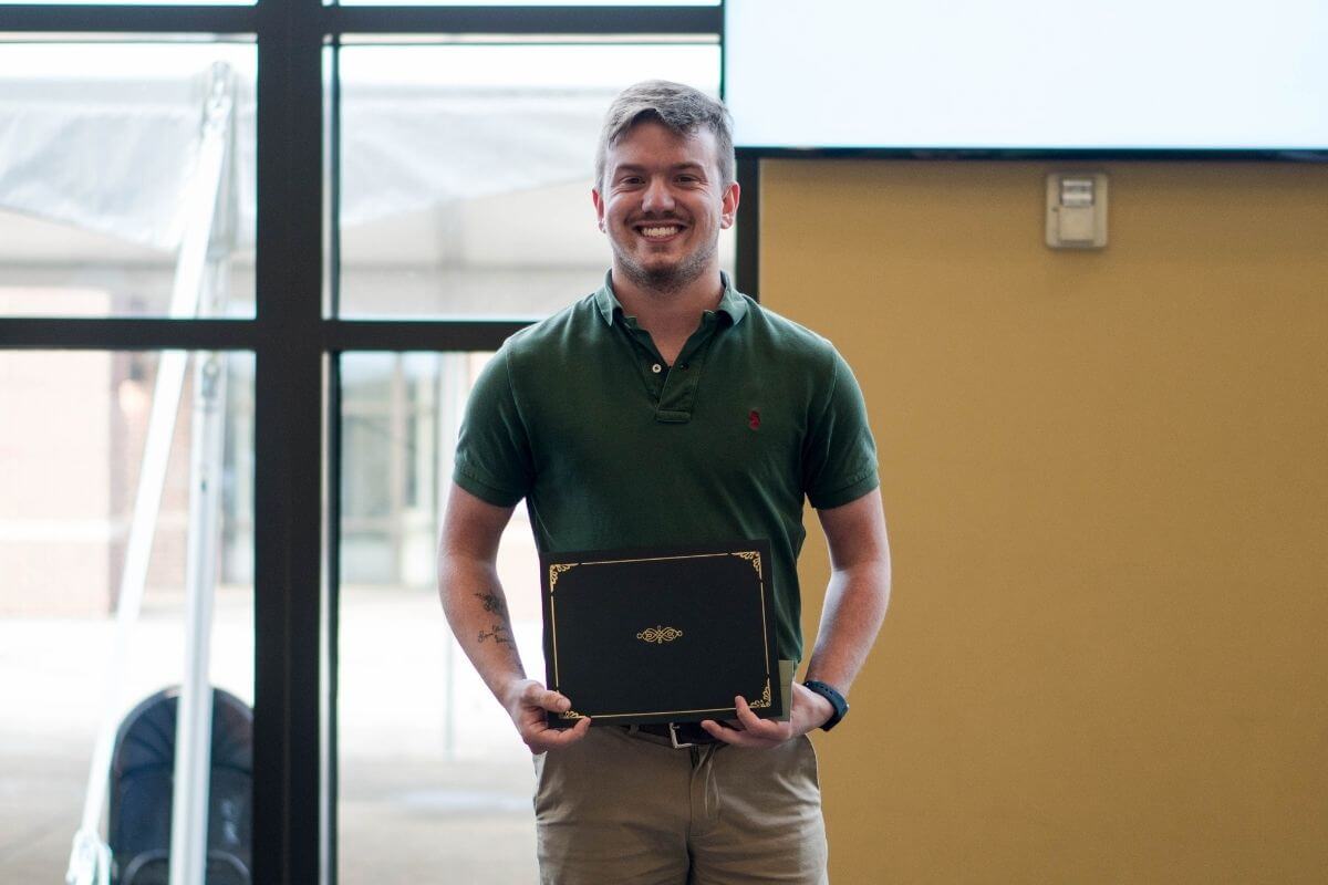 Photo of Kristopher Seiber accepting award