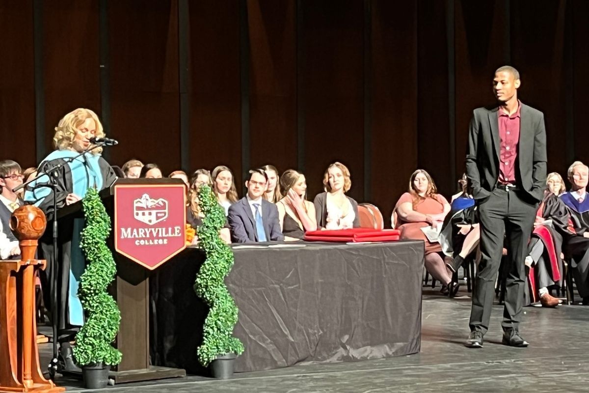 Photo of faculty member introducing student