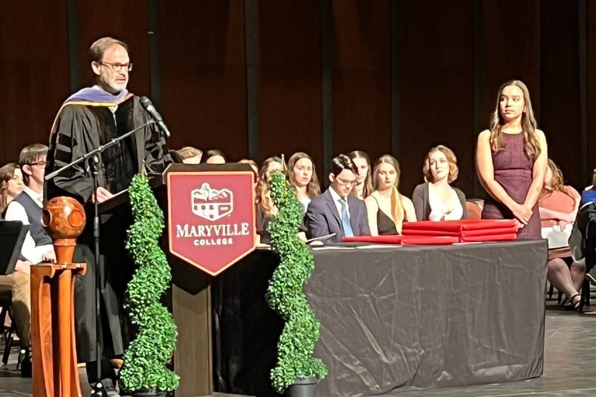 Photo of Dr. Henson introducing student