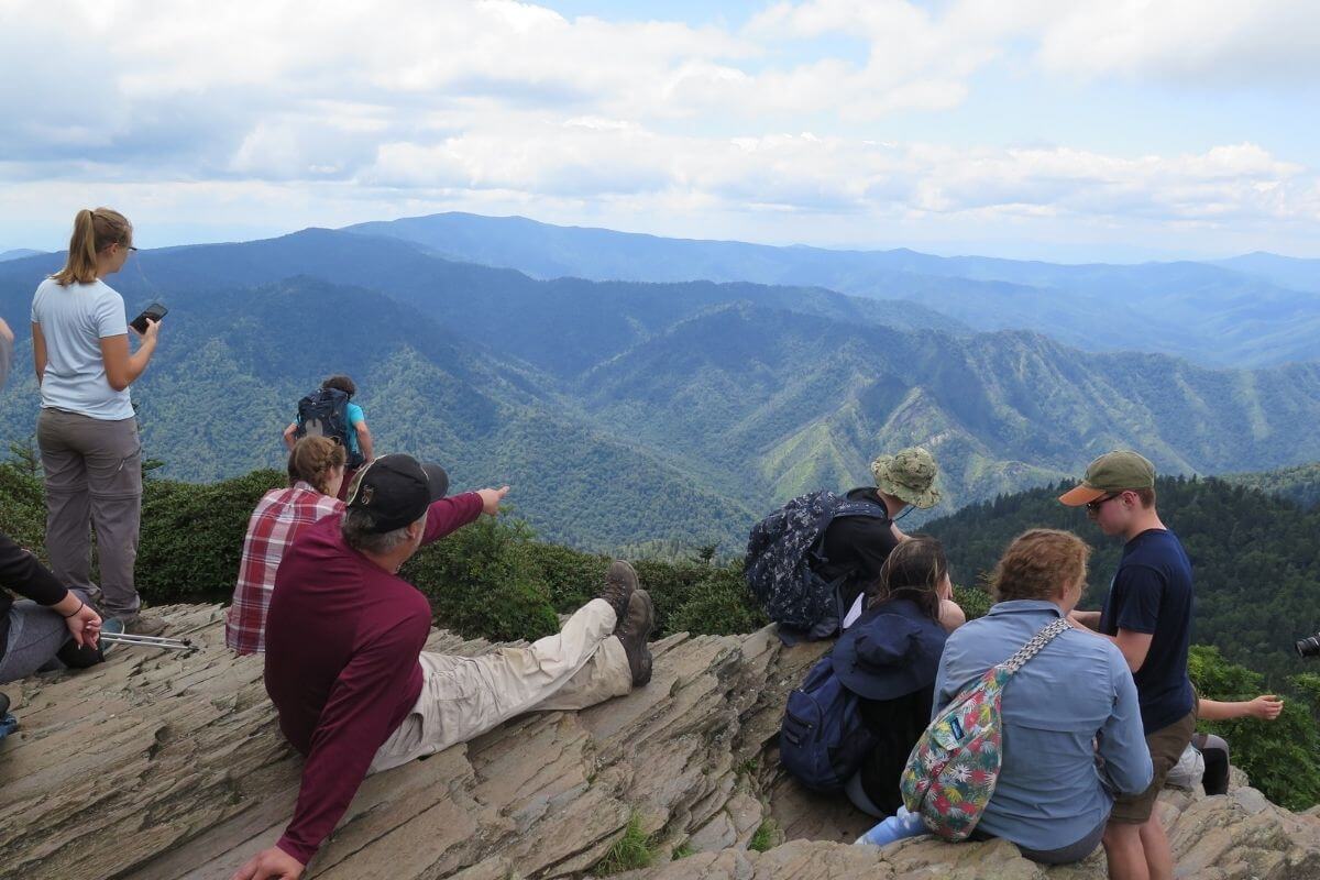 Photo of students on a rock