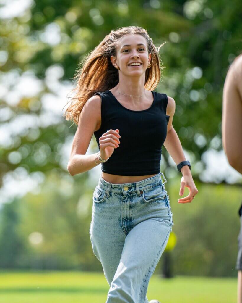 Photo of MC student Carla Guenzi running and smiling