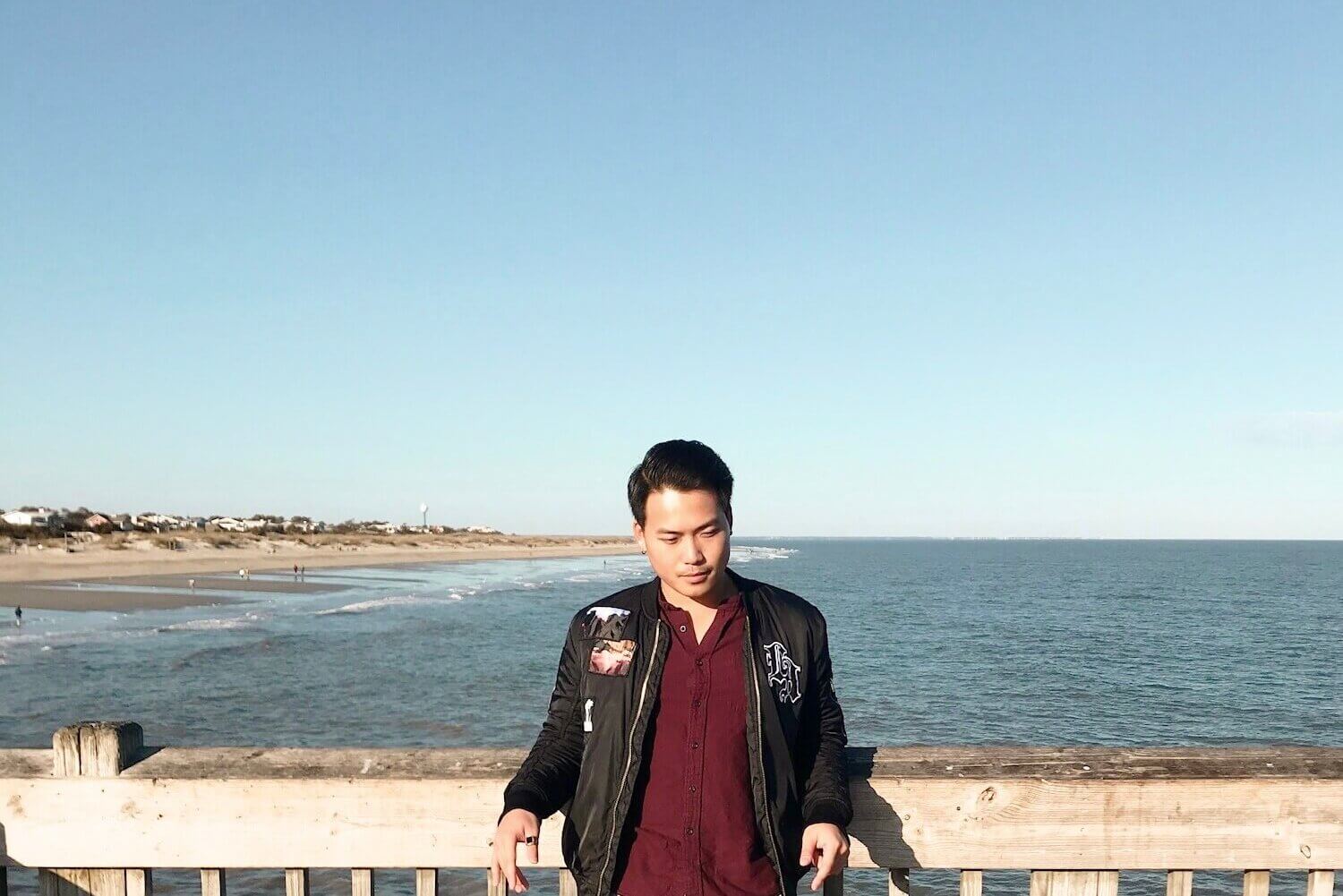 Photo of Minh Hoàng standing on a pier