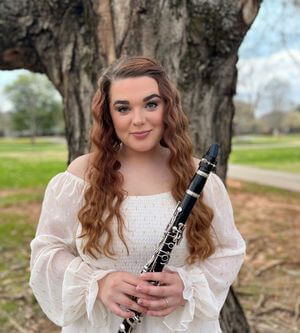 Photo of student holding clarinet