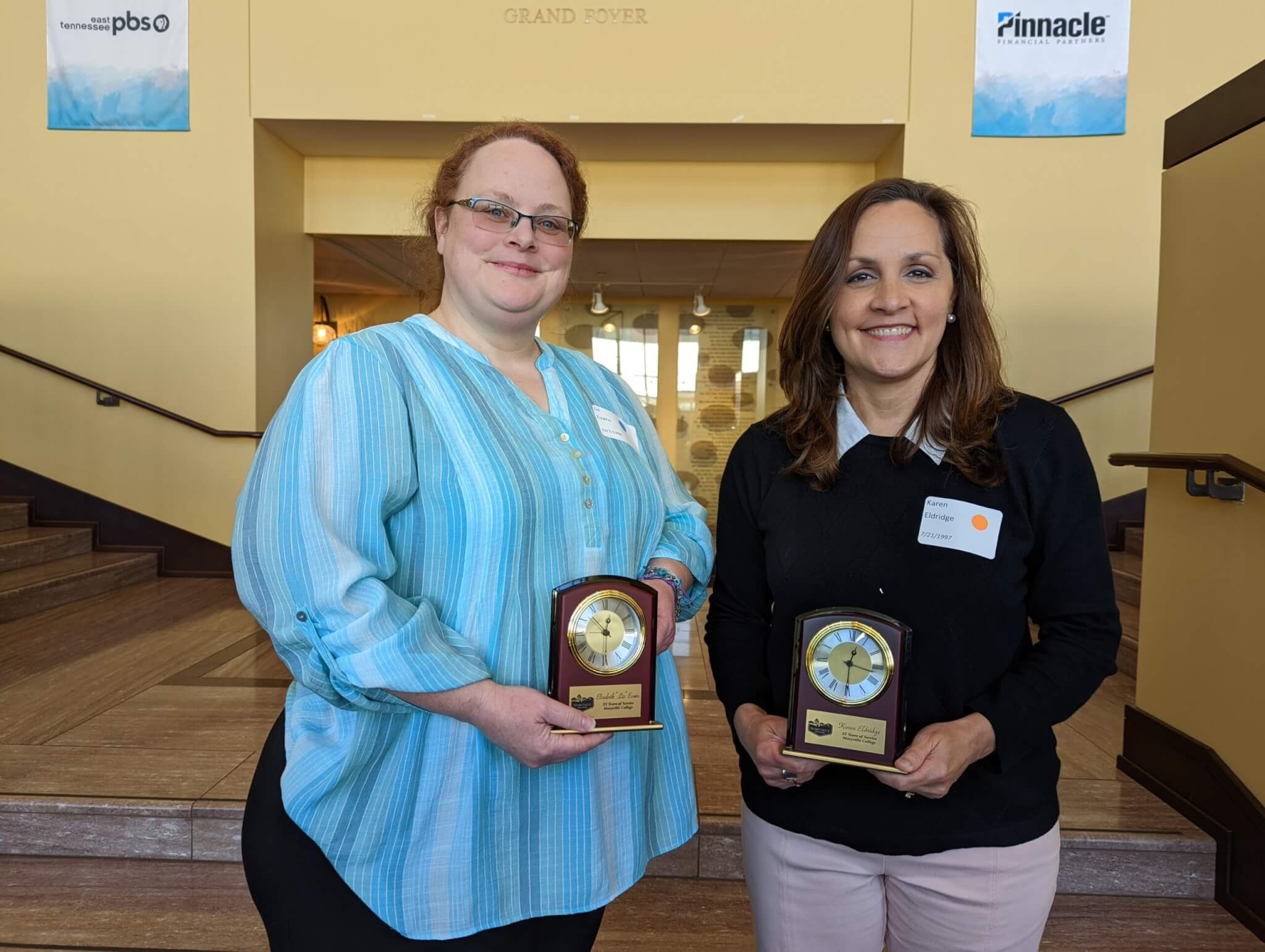 Photo of staff members being recognized