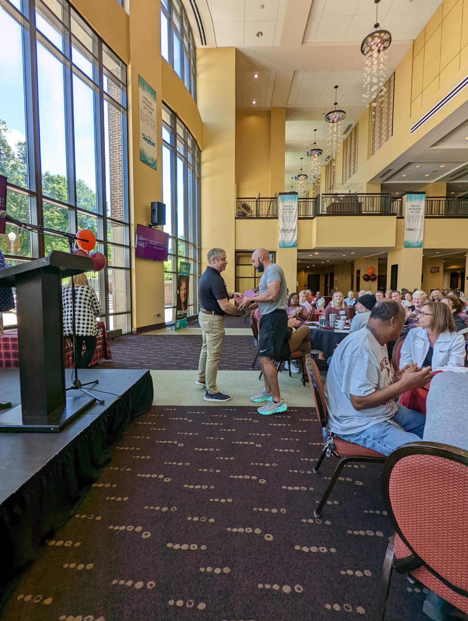 Photo of staff members being recognized