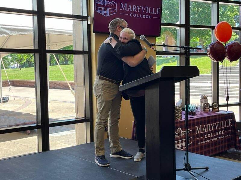 Photo of staff members being recognized