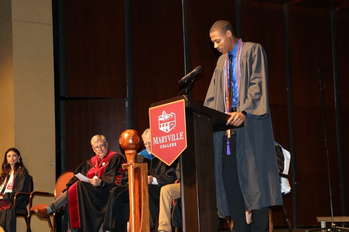 Photo of Nicholas Clifton reading scripture