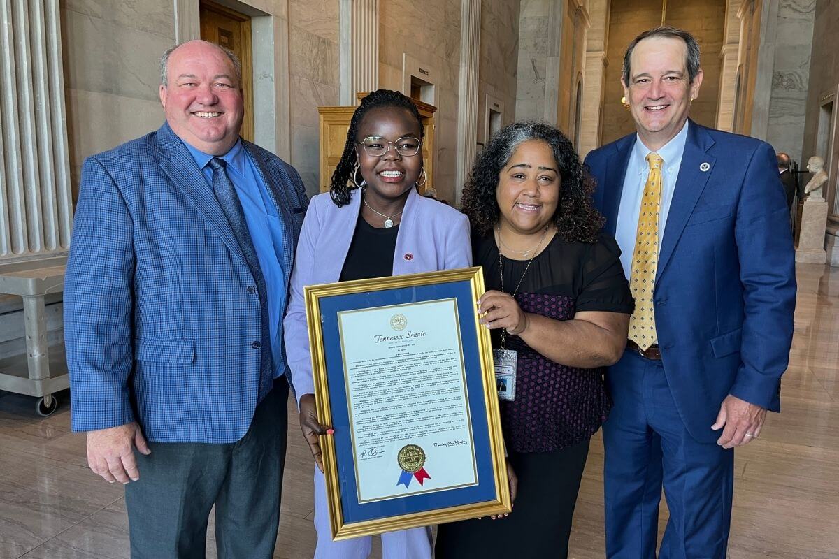 Photo of Jeff McCord and Chris Hurley with Betty Asha and Sen. Akbari