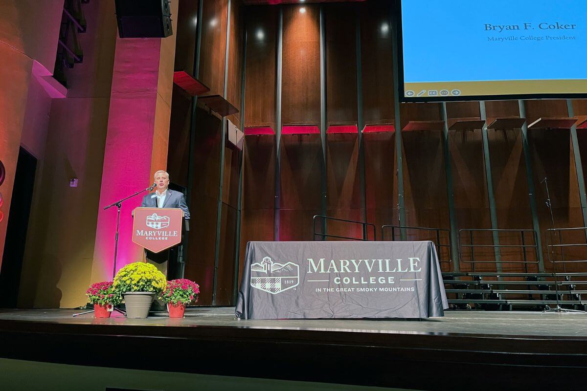 Photo of Dr. Bryan Coker speaking at a podium
