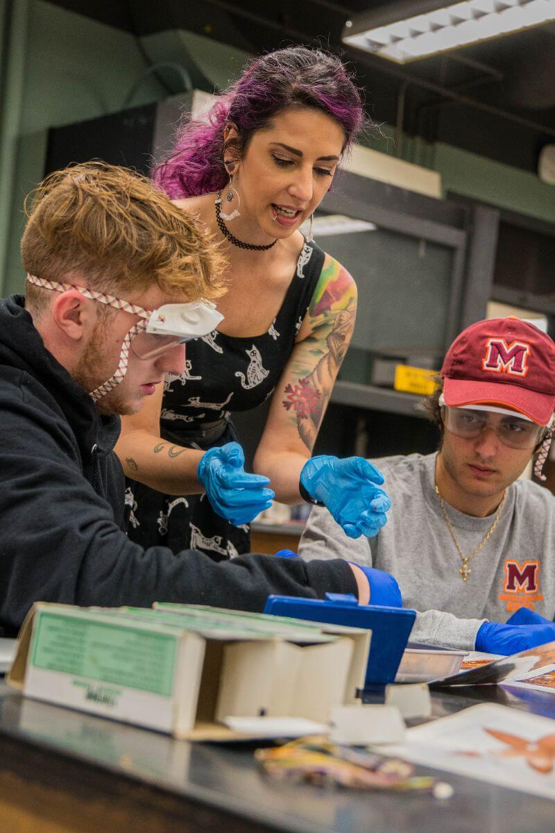Photo of Dr. Buongiorno guiding students through dissection of a sea creature