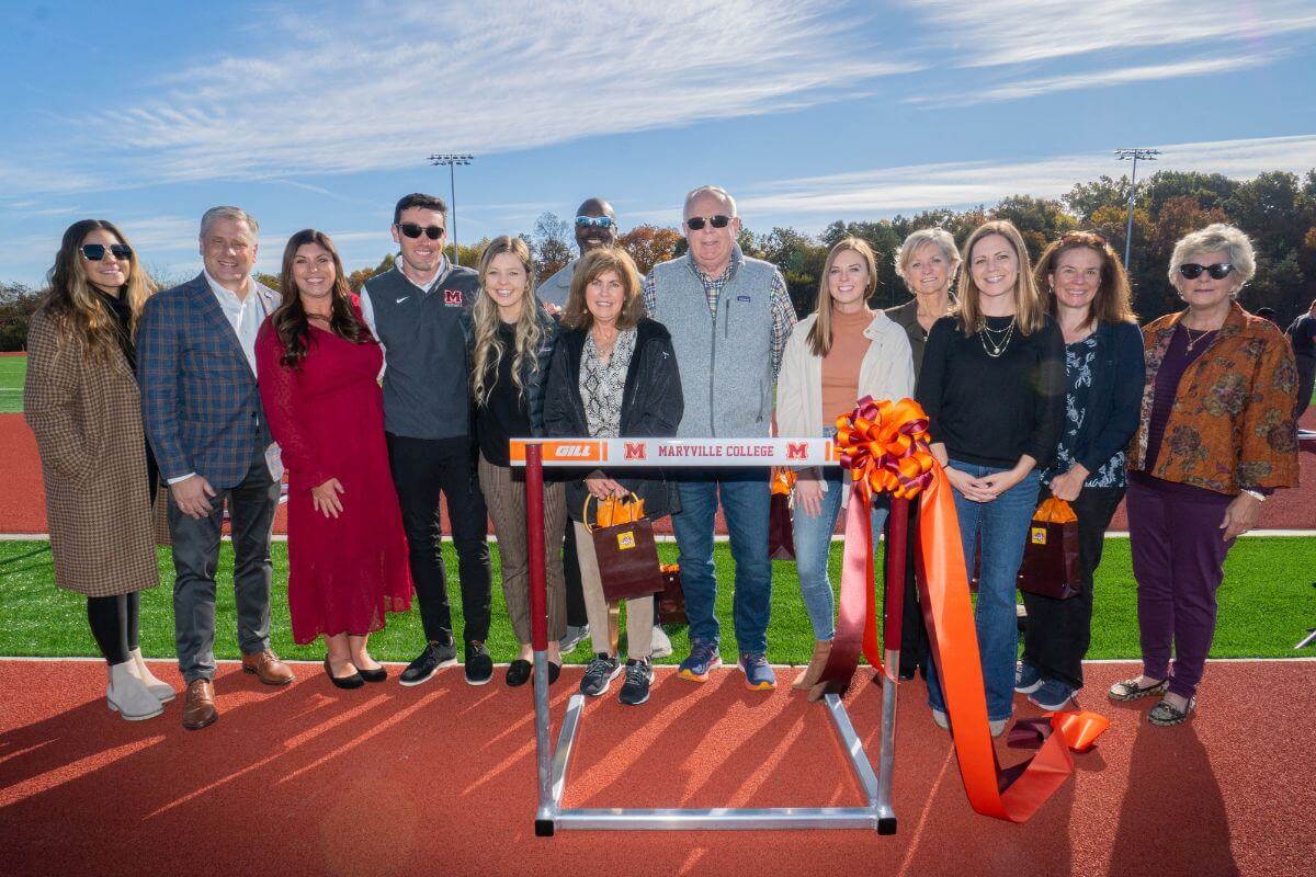 A photo of people gathered for the Austin Coleman Piper Memorial Track dedication