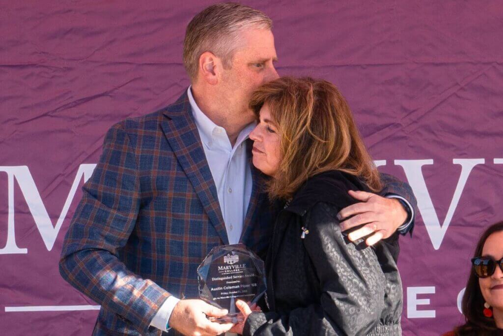 A photo of Dr. Bryan F. Coker with Sue Piper.