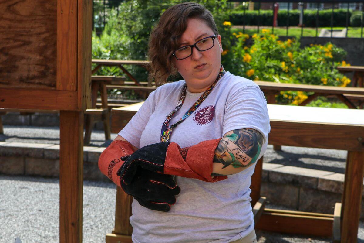 Photo of Dr. Danielle Lincoln putting on gloves