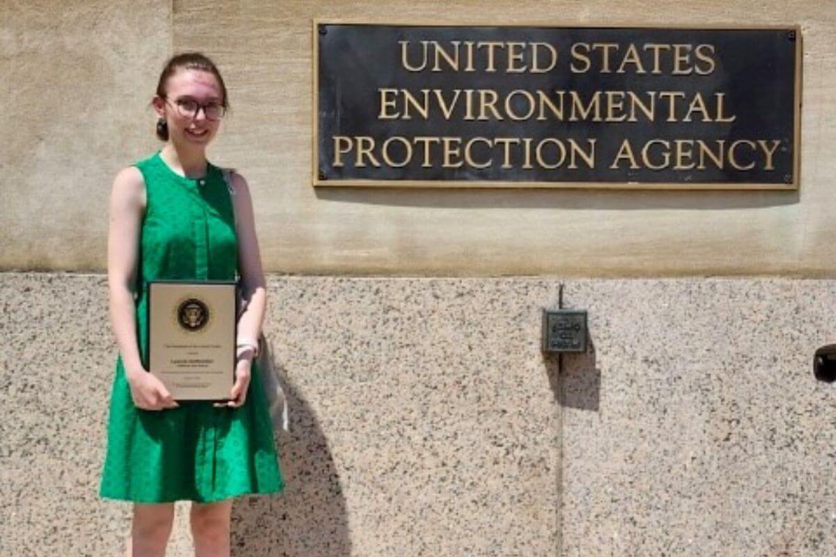 Photo of Lauren Huffstetler holding PEYA Award