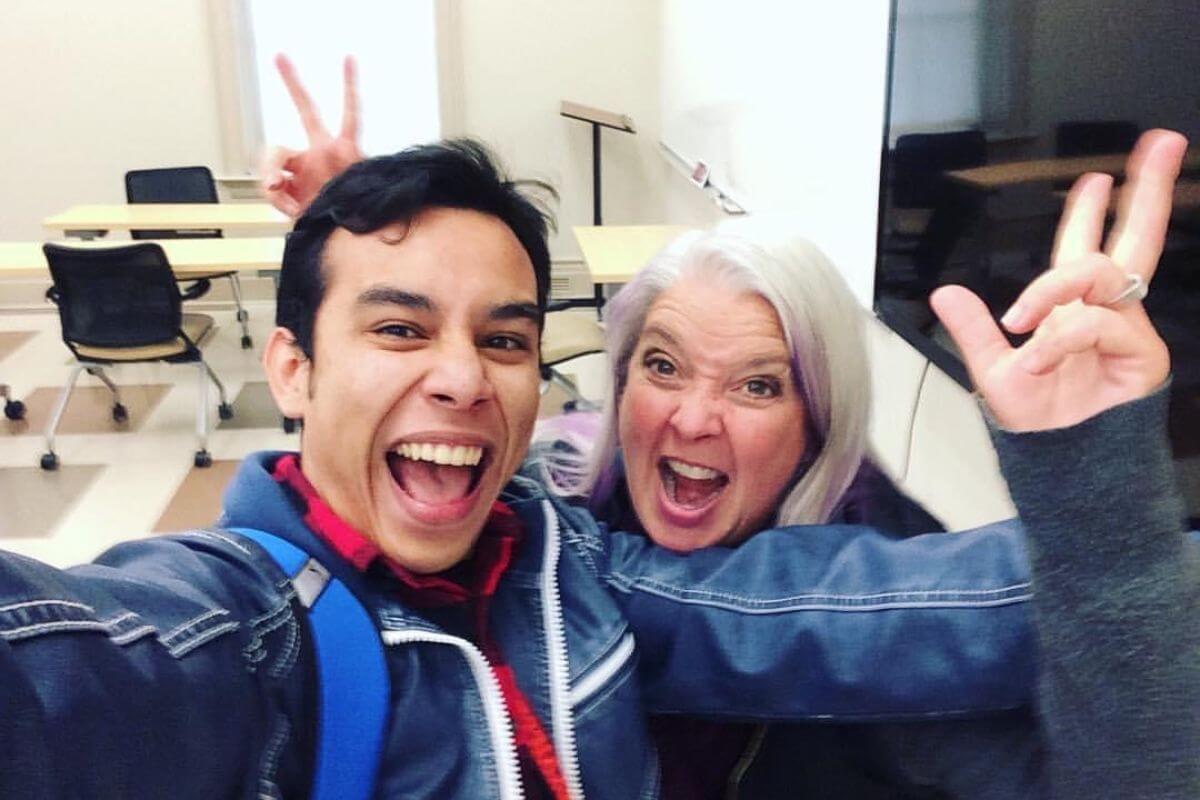 Photo of Becky Lucas making playful faces with an international studies student