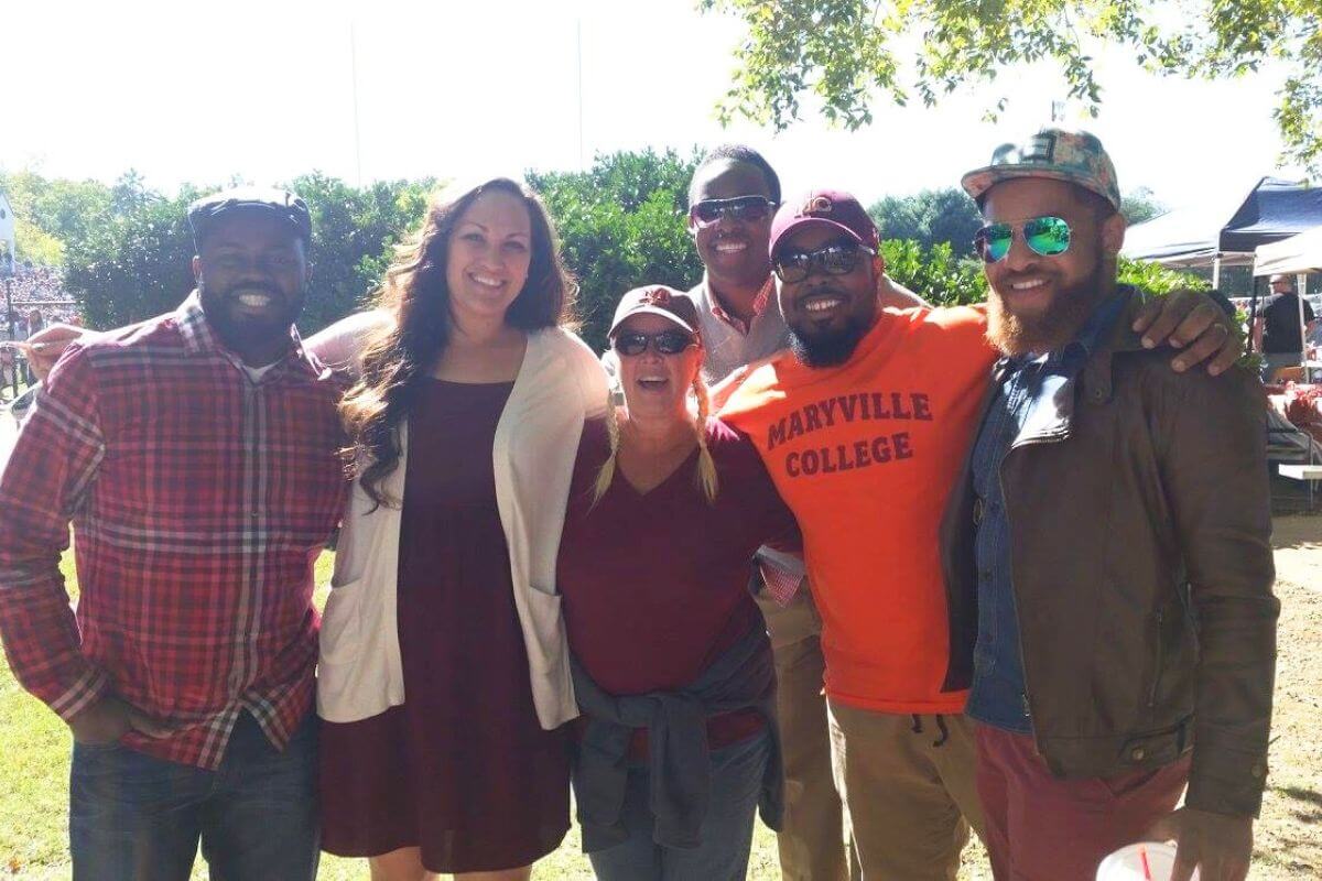Photo of Rebecca Lucas with MC alumni during Homecoming weekend