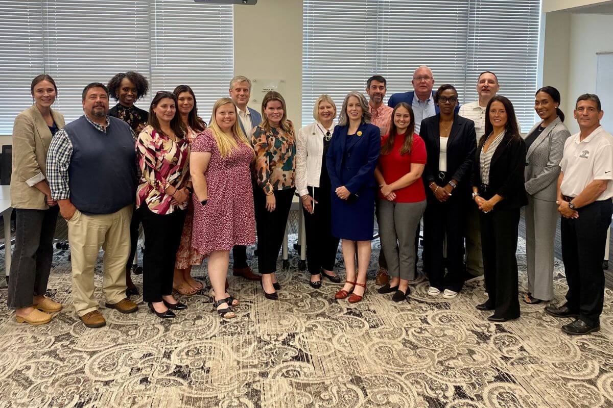 Photo of Dr. Bryan Coker with presidents and athletic administrators from the Collegiate Conference of the South