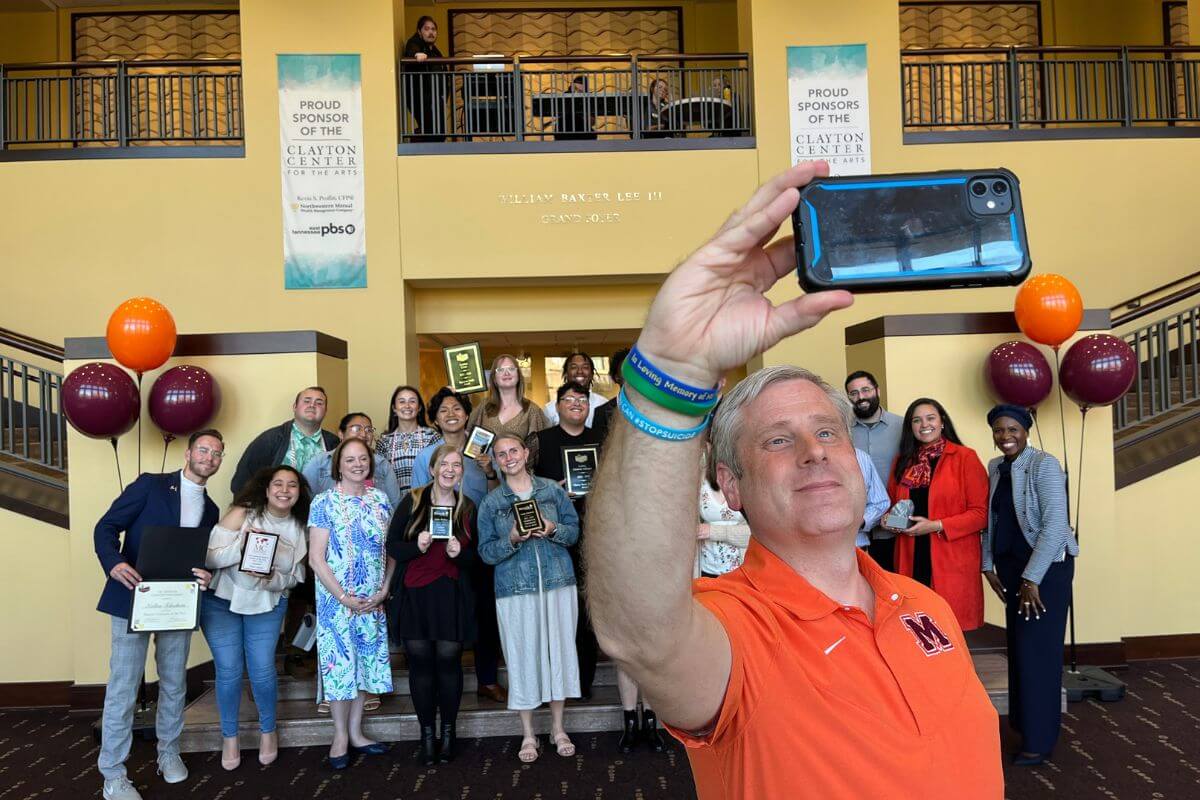 Photo of Dr. Bryan Coker taking a selfie with MC Leadership Awards winners